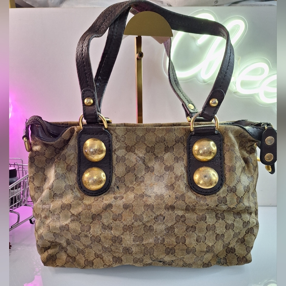 Elegant Brown Shoulder Bag with Monogram Pattern and Gold Accents